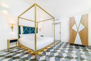 Łóżko lub łóżka w pokoju w obiekcie Palazzo Vitagliano