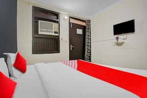 Postel nebo postele na pokoji v ubytování Hotel O Dremland Residency