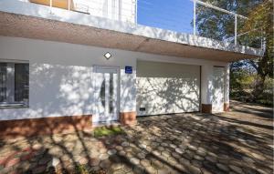 a white house with a driveway at Amazing Apartment In Imotski in Imotski