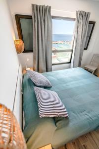 Postel nebo postele na pokoji v ubytování Casa balcón al mar