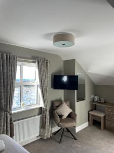 TV o dispositivi per l'intrattenimento presso Glasha Meadows Accommodation