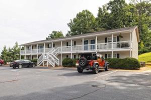 a car parked in a parking lot in front of a house at Overlook Club C6 L Spacious And Cozy in Cumming