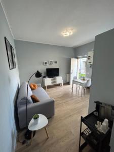 a living room with a couch and a table at Altavilla Apartments Roma in Rome +18 photos
