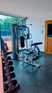 a gym with a cardio machine in a room at Mirador del Laguito 13003 in Cartagena de Indias