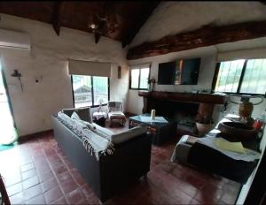 a living room with couches and a fireplace at Casa Naranja in San Javier