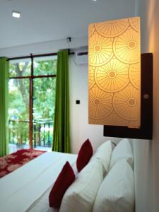 Postel nebo postele na pokoji v ubytování Randon Resort Mirissa