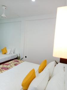 Postel nebo postele na pokoji v ubytování Randon Resort Mirissa