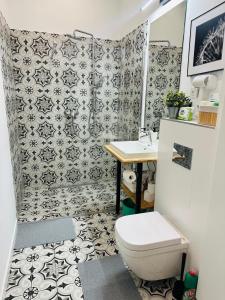 a bathroom with a toilet and a sink at Apartamenty Narutowicza 52 parking free in Lublin