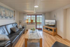 TV a/nebo společenská místnost v ubytování Neukoog Deichzeit