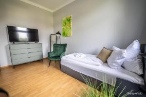 Μια τηλεόραση ή/και κέντρο ψυχαγωγίας στο Apartment für Alleinreisende