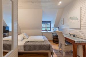 Giường trong phòng chung tại Neukoog Auszeit