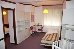 A bed or beds in a room at Albergo Residence Italia Vintage Hotel