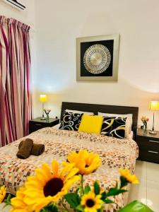 a bedroom with a bed with yellow flowers on it at Seaside Spinola APT in St Julians, Queen beds in St Julian's