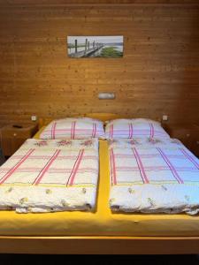 Postel nebo postele na pokoji v ubytování Haus Waldegg 84