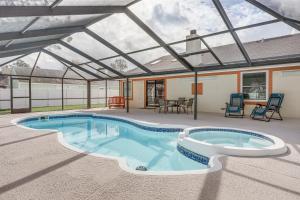 a swimming pool with a retractable roof at Home with Pool 5 Mi to Neptune Beach in Jacksonville in Jacksonville