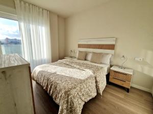 a bedroom with a bed and a large window at SR Wellingtonia Estepona Centro in Estepona +40 photos
