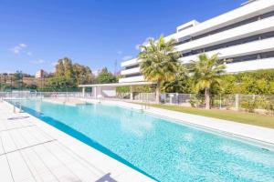 an empty swimming pool in front of a building at SR Wellingtonia Estepona Centro in Estepona