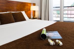 Postel nebo postele na pokoji v ubytování Starlet Hotel