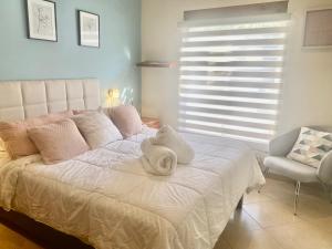 Ένα ή περισσότερα κρεβάτια σε δωμάτιο στο Casa Ejecutiva Acogedora Impecable AGS