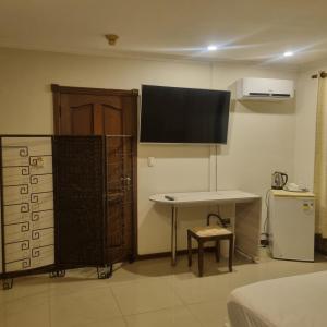 TV a/nebo společenská místnost v ubytování Hotel Condominio Casa Blanca + 4 fotografie