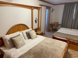 Postel nebo postele na pokoji v ubytování Hotel Valle Verde - Rent Ski & Bike