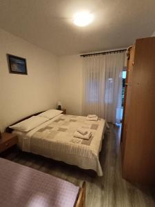 Postel nebo postele na pokoji v ubytování Apartments Lana