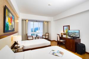 Postel nebo postele na pokoji v ubytování Starlet Hotel