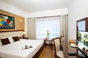TV a/nebo společenská místnost v ubytování Starlet Hotel