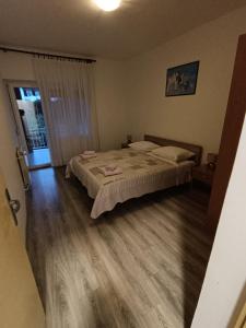 Postel nebo postele na pokoji v ubytování Apartments Lana + 37 fotografií