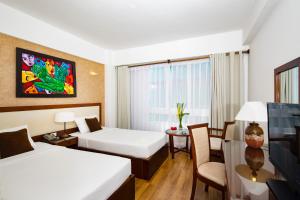 Postel nebo postele na pokoji v ubytování Starlet Hotel