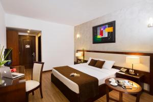 Postel nebo postele na pokoji v ubytování Starlet Hotel