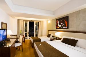 TV a/nebo společenská místnost v ubytování Starlet Hotel