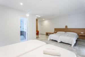 Postel nebo postele na pokoji v ubytování Hotel El Tujjar + 46 fotografií