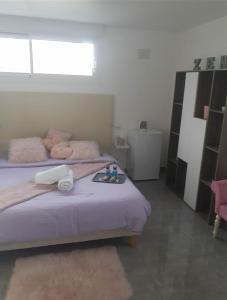 a bedroom with a bed with a tray on it at Love Room Douceur in Tremblay-En-France +2 photos