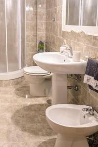 a bathroom with a toilet and a sink at NINA'S HOUSE - Monti Residences in Rome