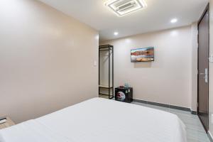 Postel nebo postele na pokoji v ubytování Hoàng Quỳnh Hotel