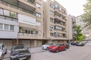 a group of cars parked in front of a building at Bright Urban Cukor Suite - Balcony - Free Parking - Near Arena & Jarun in Zagreb