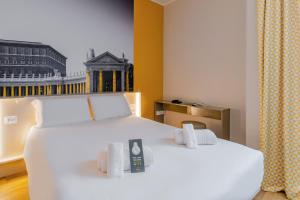 Postel nebo postele na pokoji v ubytování B&B Hotel Roma Pietralata Tiburtina