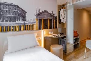 Postel nebo postele na pokoji v ubytování B&B Hotel Roma Pietralata Tiburtina