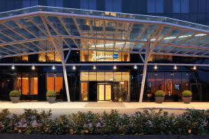 a building with a sign on the front of it at Radisson Blu Plaza Hotel Ljubljana in Ljubljana