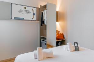 Postel nebo postele na pokoji v ubytování B&B Hotel Roma Pietralata Tiburtina