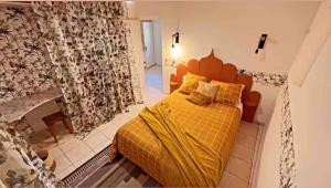 En eller flere senge i et værelse på Maison de vacances spa