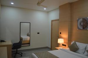 Postel nebo postele na pokoji v ubytování JBR Residency