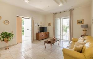 a living room with a couch and a table at villa pia in Piumarola