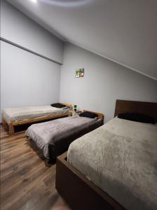 Postel nebo postele na pokoji v ubytování Willa Wiekowa Sosna