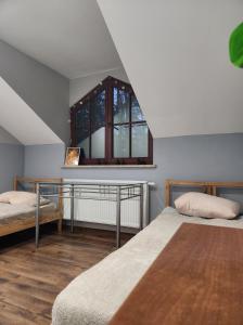 Postel nebo postele na pokoji v ubytování Willa Wiekowa Sosna