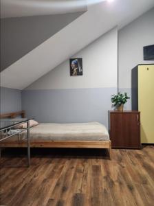 Postel nebo postele na pokoji v ubytování Willa Wiekowa Sosna