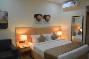 Postel nebo postele na pokoji v ubytování JBR Residency