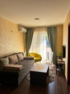 a living room with a couch and a table at Dale apartment Becici- Paradiso in Budva