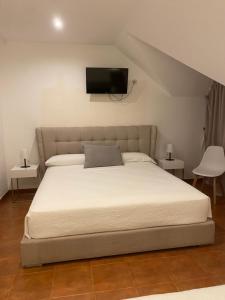 Postel nebo postele na pokoji v ubytování Hotel Doña Matilde